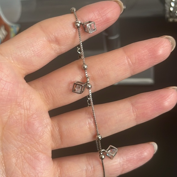 Delicate silver bracelet with small dangly charms - Picture 2 of 3